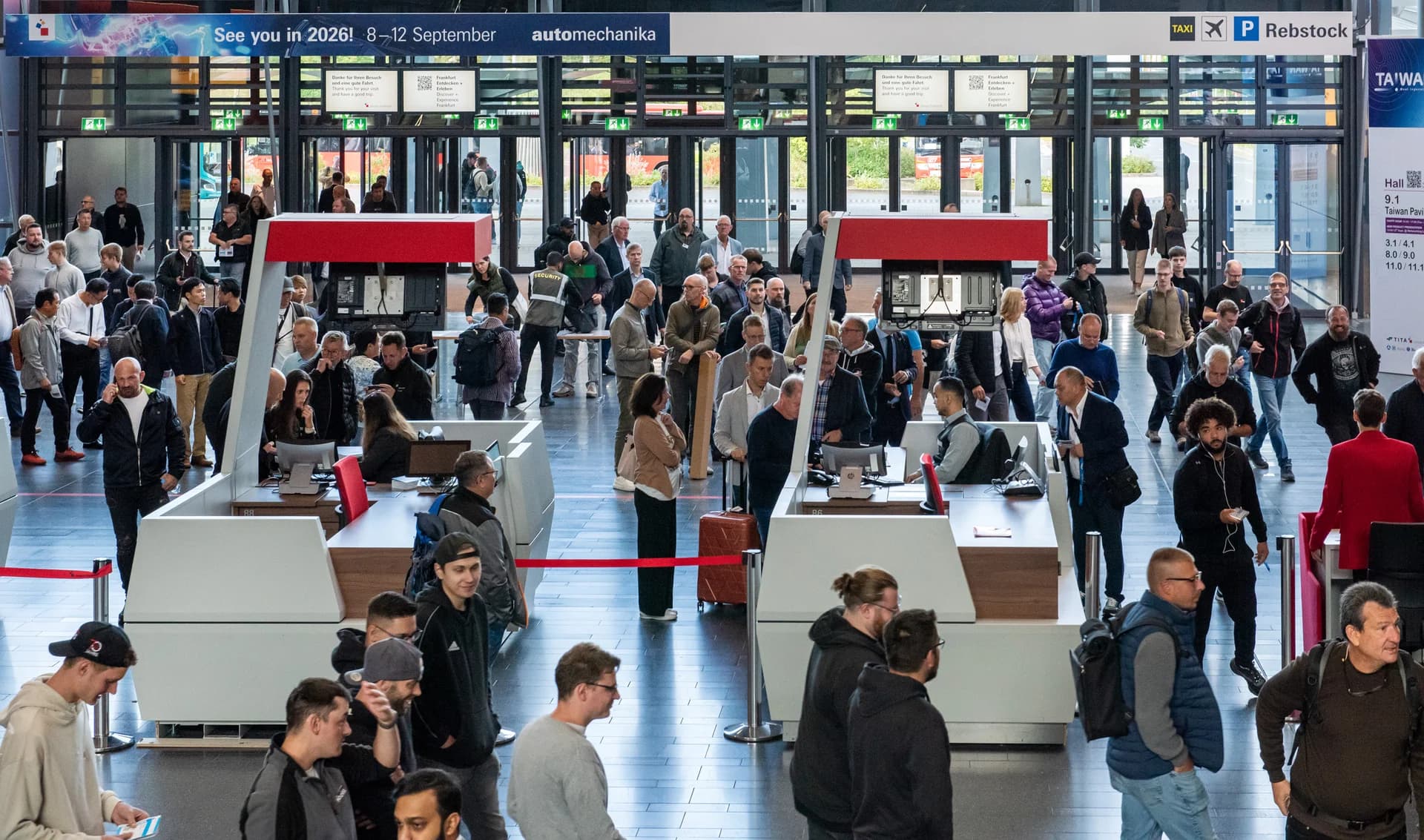 Visitors arriving at Automechanika Frankfurt beneath the 2026 event banner