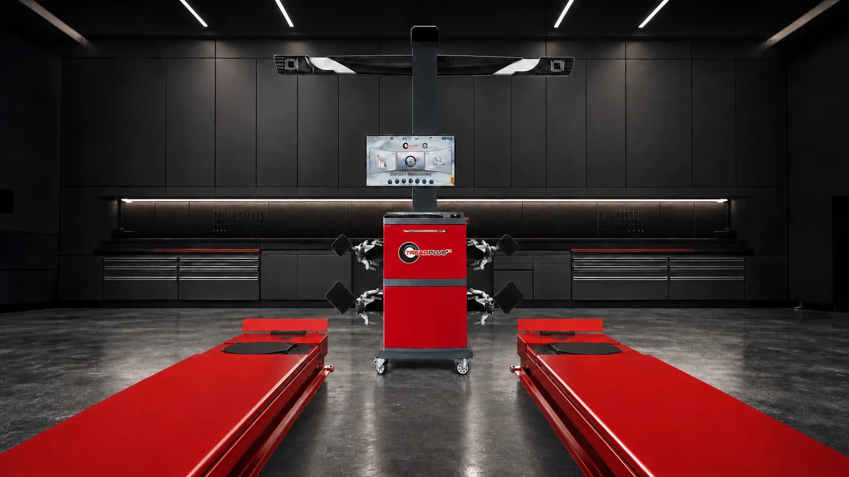 TreadPlus 9000 Mobile wheel alignment system with a red alignment lift in a dark professional workshop