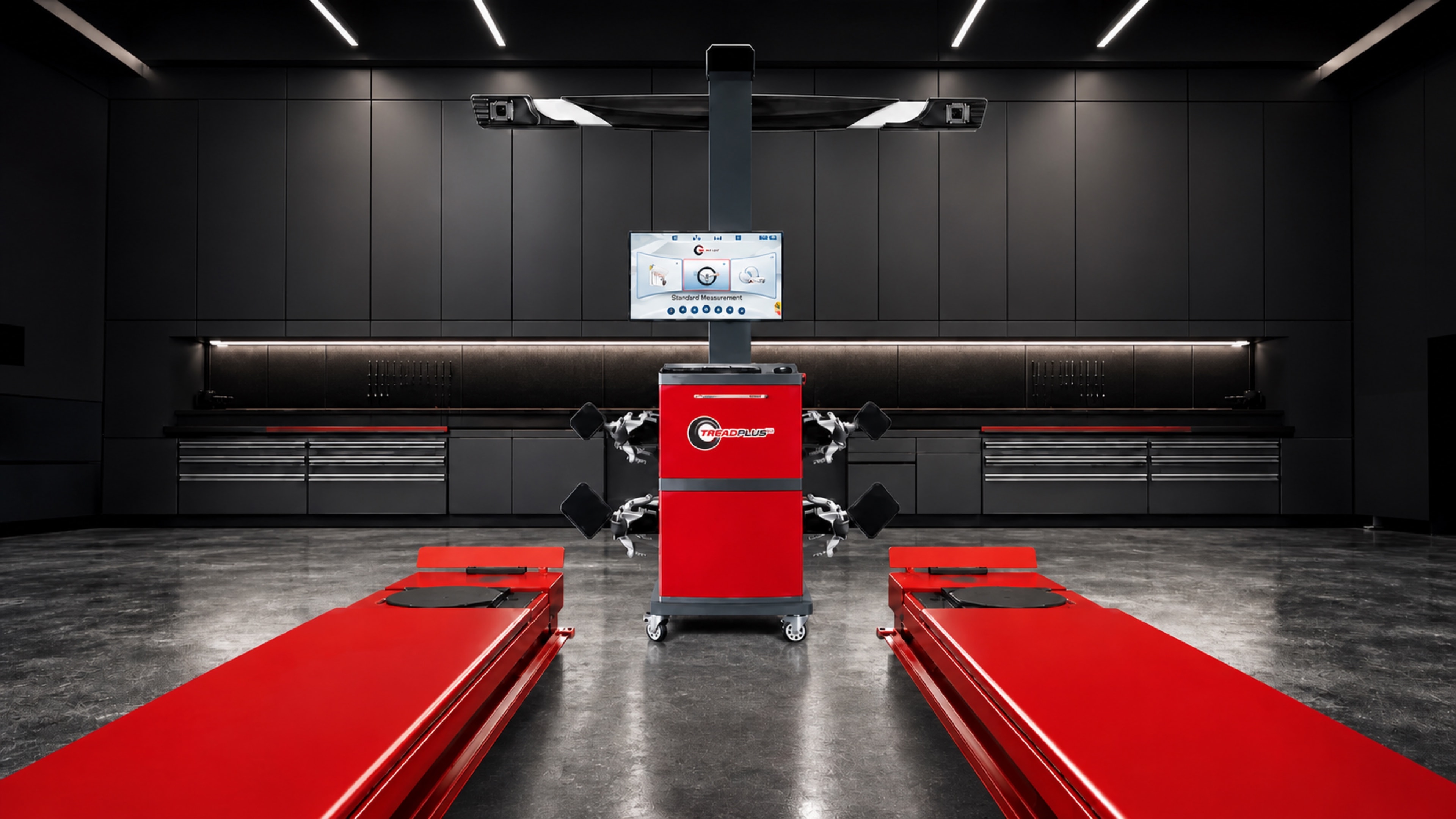 TreadPlus 9000 Mobile wheel alignment system with a red alignment lift in a dark professional workshop